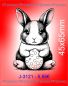 Hase mit Ei